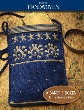 A small, blue handwoven bag adorned with beige star and sun patterns is showcased on a wooden surface, with a gold card partially visible at the top. The caption reads, "Best of Handwoven by Long Thread Media: A Baker's Dozen – 13 Bags to Weave.