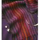 The "Best of Handwoven Technique Series: Twills on Four Shafts" eBook by Long Thread Media is printed, featured atop a deep purple fabric with a colorful wool scarf in red, purple, and orange shades. Two shiny silver beads and an open bangle add a touch of elegance.