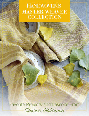 The cover of "Handwoven's Master Weaver Collection: Favorite Projects and Lessons from Sharon Alderman eBook Printed Copy" by Long Thread Media features a woven textile in earthy tones, draped over a ceramic plate with green leaves scattered around.