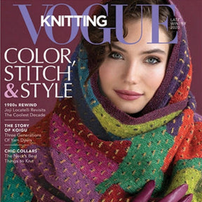 Magazine cover titled "Vogue Knitting Late Winter 2019" by Soho Publishing. A woman drapes herself in a vibrant, faerie fantasy-inspired knitted shawl as she gazes at the viewer. The text showcases articles on color, stitch, and style, alongside enchanting knitting stories and accessory inspirations.