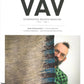 Cover of VÄV Magazine, issue Nr. 4, 2023. The cover features a man with glasses, a beard, and a Mohawk hairstyle peeking from behind a woven textile with a beige base and striped patterns in green, blue, and brown—a true testament to how Textile Material Speaks.