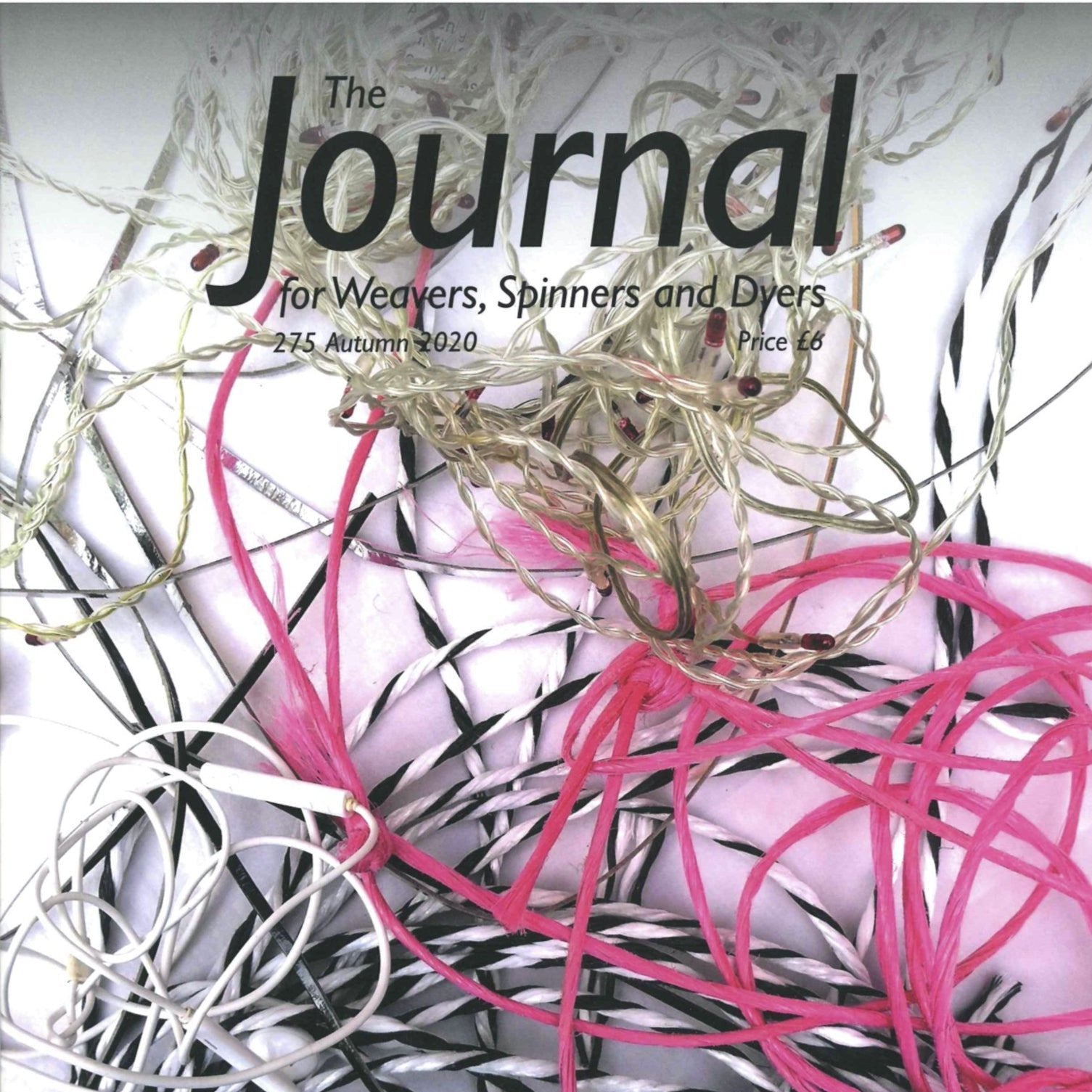 Cover of "The Journal for Weavers, Spinners and Dyers - UK - Issue 275, Autumn 2020" by The Journal For Weavers, Spinners and Dyers, featuring a vibrant array of pink, black, and white yarns and threads on a light background—a lively homage to the artistry of spinners.