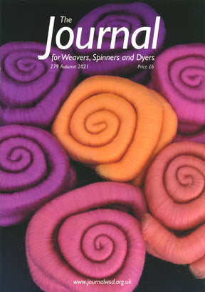 Cover of "The Journal For Weavers, Spinners and Dyers - UK - Issue 279, Autumn 2021." Spirals of bright wool fibers in shades of purple, pink, and orange captivate attention. The cover text displays the journal title along with the issue number (279), the price (£6), and the website URL.