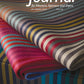 Presenting the cover of "The Journal for Weavers, Spinners and Dyers - UK - Issue 291, Autumn 2024." This colorful edition features an image of folded fabric with vibrant parallel stripes. Priced at £6, you can find more information at www.wsd.org.uk.