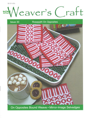 Cover of Weaver's Craft Issue 30: Rosepath on Opposites by Plain Tabby Press. The image displays a tray featuring woven red and white patterned napkins, a cup of hot chocolate with marshmallows, and two cookies. The text highlights phrases such as "On Opposites Bound Weave" and "Mirror-Image Selvedges," emphasizing the Rosepath technique.