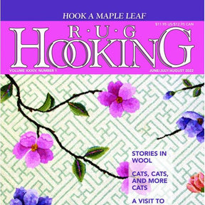 The Rug Hooking Magazine June/July/August 2022 edition by Ampry Publishing features a magazine cover with a stunning floral design of purple flowers set against a patterned green background. It highlights an antique flower basket pattern with headlines such as "Hook a Maple Leaf," "Stories in Wool," and "Cats, Cats, and More Cats.