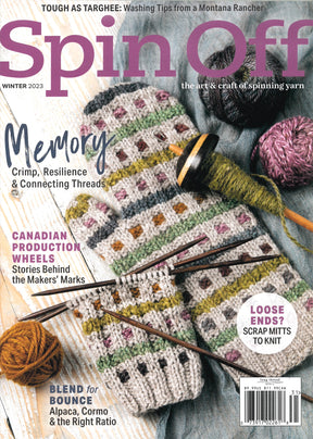 The cover of Spin Off Winter 2023 by Long Thread Media showcases vibrant yarn balls, a checkered knit piece made from Targhee wool, and knitting needles. The headlines highlight topics such as yarn spinning, Canadian production wheels, and inventive projects using scrap mitts.