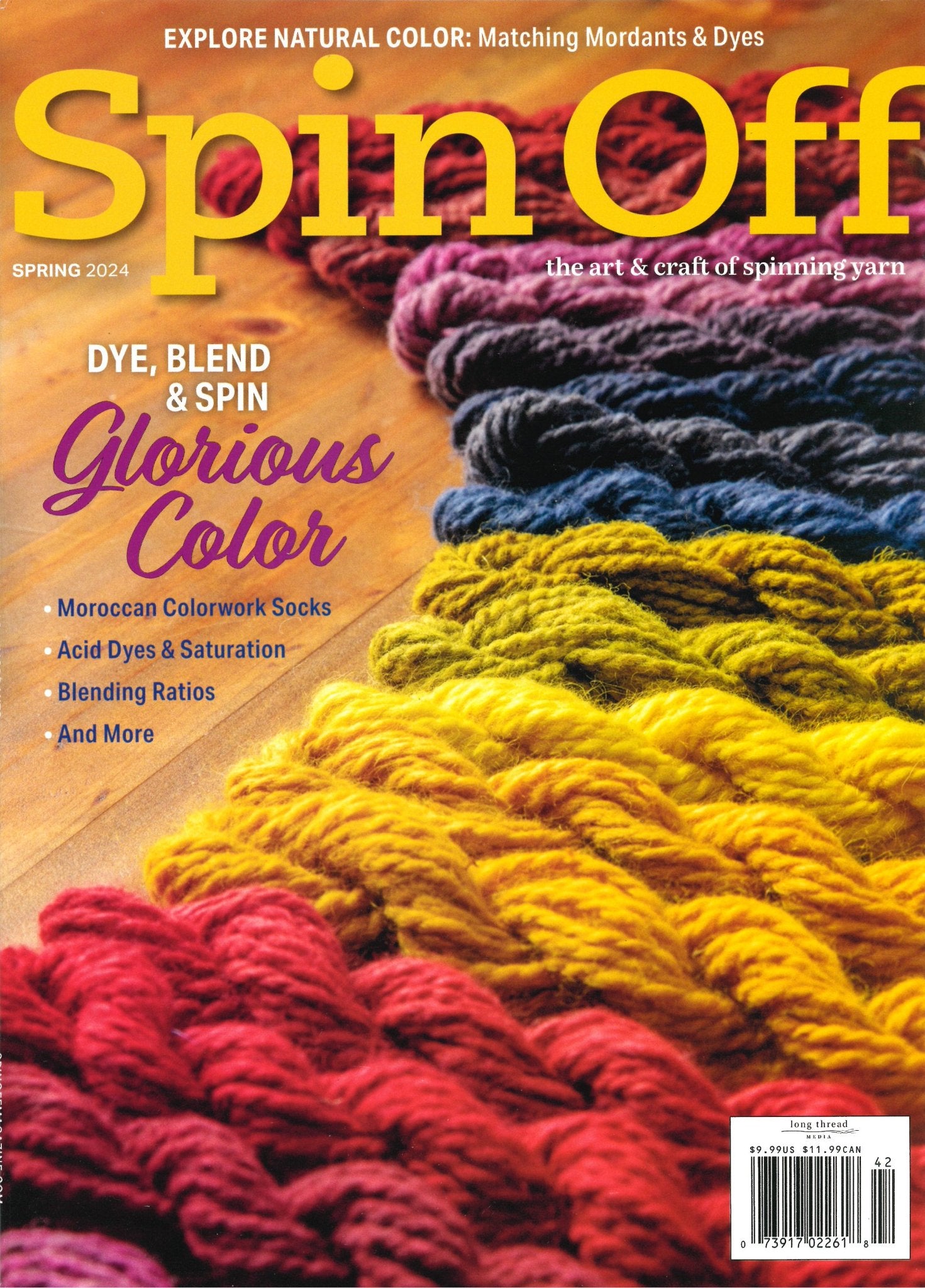 The cover of Long Thread Media's "Spin Off," Spring 2024 edition, titled "Dye, Blend & Spin Glorious Color." The image features skeins of yarn in vibrant natural colors arranged diagonally. Articles include "Moroccan Colorwork Socks," "Acid Dyes & Saturation," and "Blending Ratios.