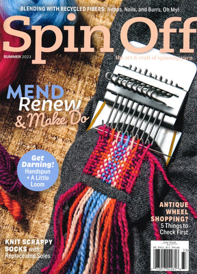 The cover of "Spin Off Summer 2023," a magazine by Long Thread Media, features an intricately handspun loom dressed with vibrant yarn and knitting tools. Key highlights are titled "Mend, Renew, & Make Do," "Get Darning," and "Knit Scrappy Socks." The edition focuses on recycling by celebrating crafts made with recycled fibers and creative handmade artistry.