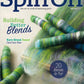 Cover of Long Thread Media's Spin Off Winter 2022. Showcases vibrant yarns and fiber blends set against a blending tool. Headlines include "Building Better Blends," "Wool Grease Wonders," and "20 Blends to Try!