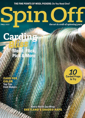 The magazine cover features a close-up of wool being carded, titled "Spin Off Fall 2023" by Long Thread Media. Highlights include "Carding Bliss" and "10 Carded Preps to Try with Wool Pickers," with a focus on blending, flicking, and color tips for the fall 2023 issue.