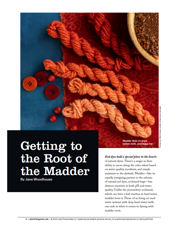 Skeins of yarn dyed with natural madder in a range of red hues are showcased alongside fabric swatches. The accompanying text from the Spin Off eBook titled "Spin Off Presents: Natural Dye Series, Exploring Palettes from Fresh-Leaf Indigo, Madder & Woad" by Long Thread Media delves into using madder dyes for coloring both wool and cotton, emphasizing this traditional technique.