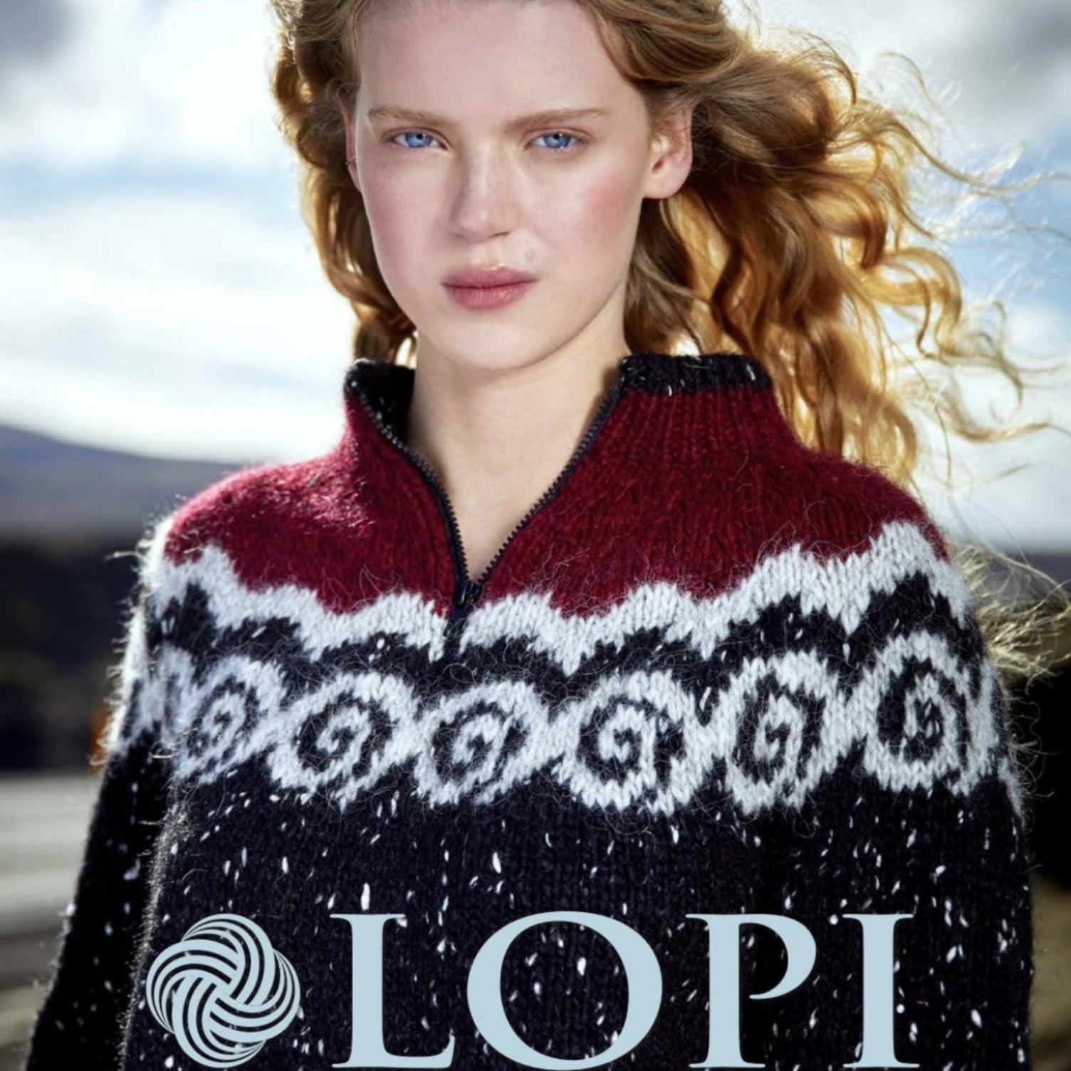 A person with long, wavy blond hair is wearing a colorful knitted sweater featuring patterns in red, white, and black. The person is outdoors, with a blurred landscape in the background. At the bottom of the image, the text "Lopi Book 38" along with Berroco's yarn ball symbol are visible.