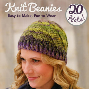 A cover of a knitting book titled "Knit Beanies - Easy to Make, Fun to Wear" by Martingale & Co, featuring a woman wearing a green and purple knitted beanie. The text "20 Hats!" is displayed in a circle on the right side of the cover. Whether you're looking for fun stitches or your next knitting project, this book has it all.