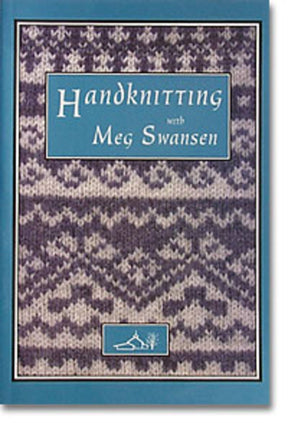 The book cover for "Handknitting with Meg Swansen" from Schoolhouse Press showcases a knitted pattern in shades of gray and white that resembles a traditional Scandinavian design, including the detailed Swedish Dubbelmössa. The title is prominently displayed within a blue rectangle, with a small tree icon positioned at the bottom center.