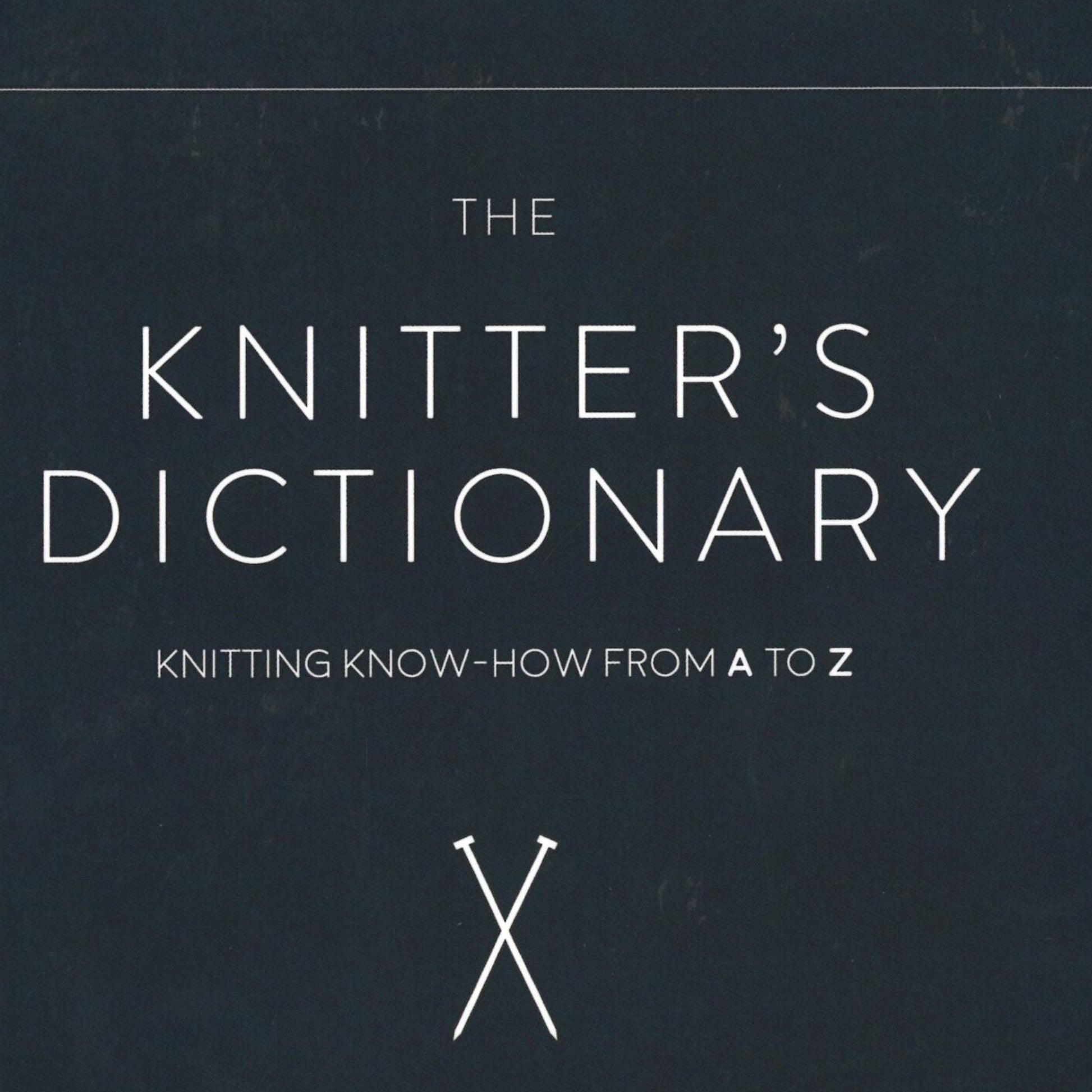 A dark background showcases the book cover adorned with the title "The Knitter's Dictionary - Knitting Know-How from A to Z" in large, white capital letters. At the bottom, an illustration of two crossed knitting needles hints at the detailed knitting terminology and patterns inside. The book is produced by Ingram Content.