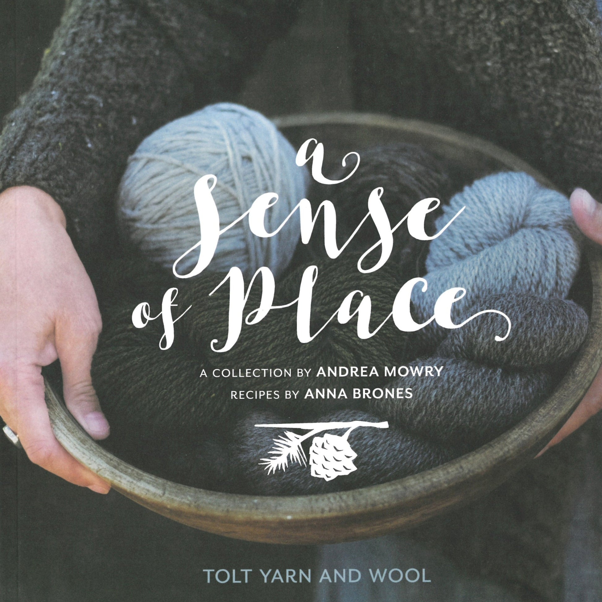 The cover of "A Sense of Place" by Never Not Knitting features a wooden bowl filled with various shades of yarn held by two hands. The title and contributors' names, Andrea Mowry and Anna Brones, are written in white script over the image. The text also mentions Tolt Yarn and Wool and showcases wooly knitting patterns.