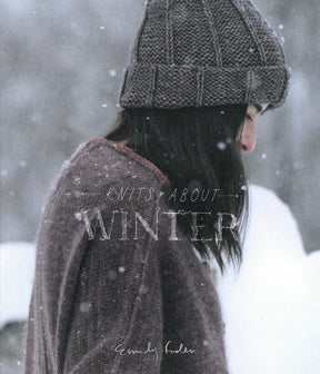 Side profile of a person standing in snowfall, wearing a knitted hat and sweater. The words "Knits About Winter" from Pom Pom Publishing are overlaid in white text on the image, showcasing cozy winter knits crafted from hand-dyed yarns.