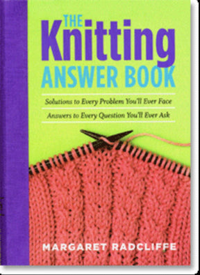 Cover of "The Knitting Answer Book - 2nd Edition" by Margaret Radcliffe, published by Workman Publishing - Storey. It features green and purple text on a blue and purple background with illustrated knitting needles and pink knitted fabric below. The subtitle reads, "Solutions to Every Problem You'll Ever Face in Your Yarn Shop. Answers to Every Question You'll Ever Ask.