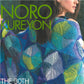 Cover of a magazine featuring a person draped in a colorful, intricately patterned knitted blanket made from Noro Kureyon yarn, showcasing various shades of blue, green, and yellow. The text reads "Noro Kureyon" in large green letters and is captioned "The 30th Anniversary Collection" by Knitting Fever / Euro Yarns at the bottom.