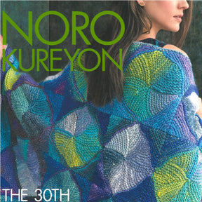 Cover of a magazine featuring a person draped in a colorful, intricately patterned knitted blanket made from Noro Kureyon yarn, showcasing various shades of blue, green, and yellow. The text reads "Noro Kureyon" in large green letters and is captioned "The 30th Anniversary Collection" by Knitting Fever / Euro Yarns at the bottom.