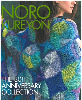 On the cover of "Noro Kureyon - The 30th Anniversary Collection" by Knitting Fever / Euro Yarns, a woman is draped in an elegant shawl featuring a colorful geometric pattern. Made with Noro Kureyon yarn, the shawl displays vibrant shades of blue, green, yellow, and purple as the woman’s face is partially turned away.