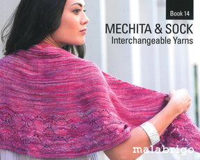 A person wearing a knitted shawl in pink and purple tones is featured on the cover of "Malabrigo Book 14 - Mechita & Sock" by Malabrigo Yarn. The individual gazes to the side, showcasing the detailed lacework of their shawl and highlighting the beauty of Mechita yarns draped over their shoulders.