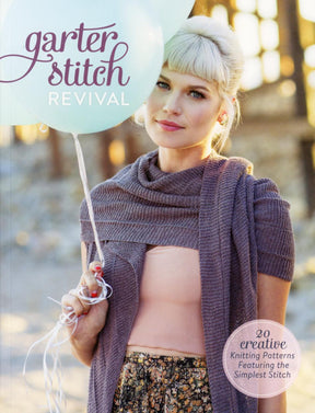 A woman with blonde hair holds a balloon and models a knitted purple shawl over a light pink top and patterned skirt. The cover text reads, "Ingram Content: Garter Stitch Revival" and "20 creative knitting patterns featuring the simplest, most sophisticated stitch.