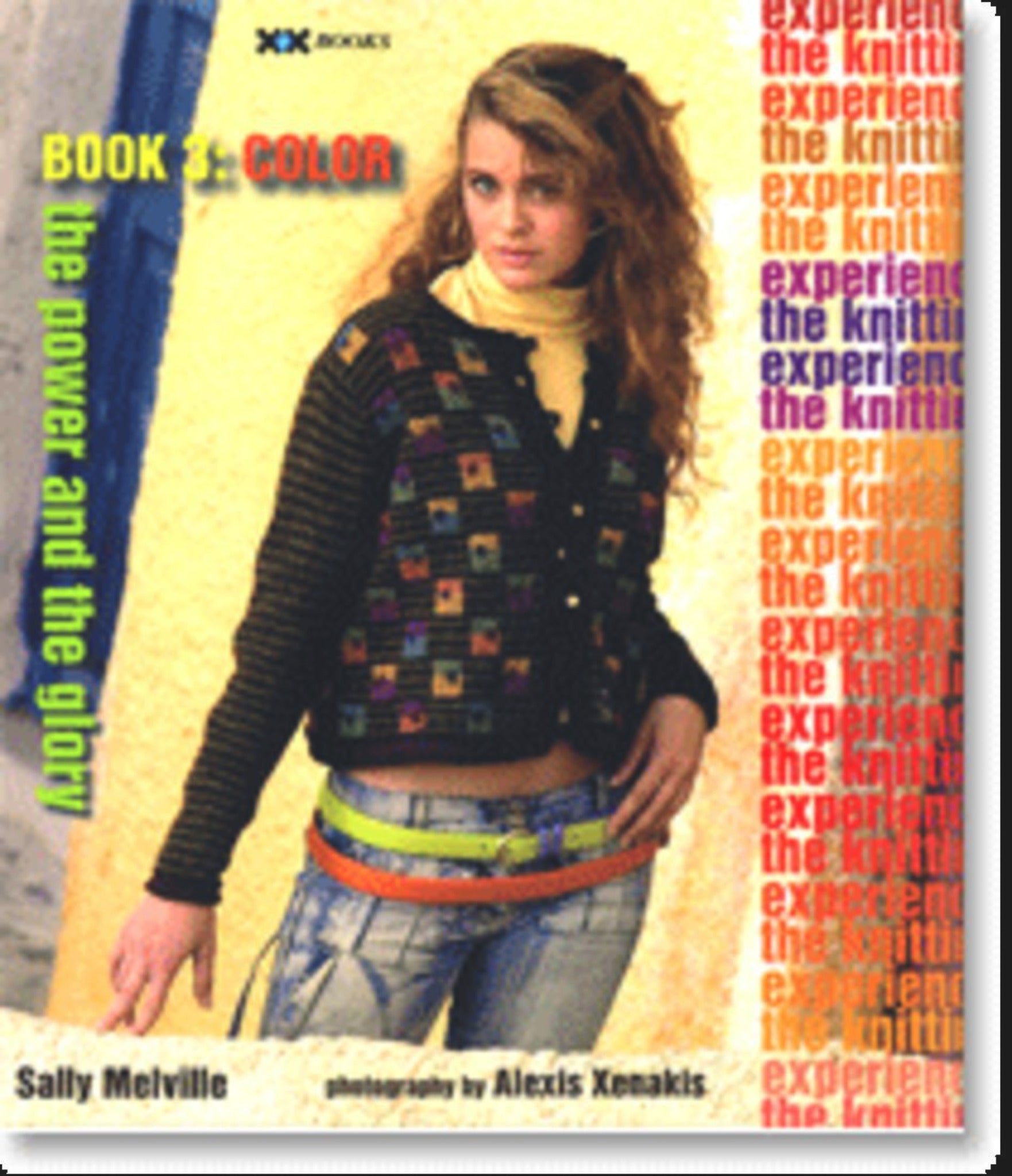 A woman wearing a colorful knitted jacket and jeans poses on the cover of "The Knitting Experience Book 3: Color" by Sally Melville, published by XRX. The background prominently displays bold text in various colors, repeating "Knitting Experience," inviting readers to learn-to-knit and explore color techniques.