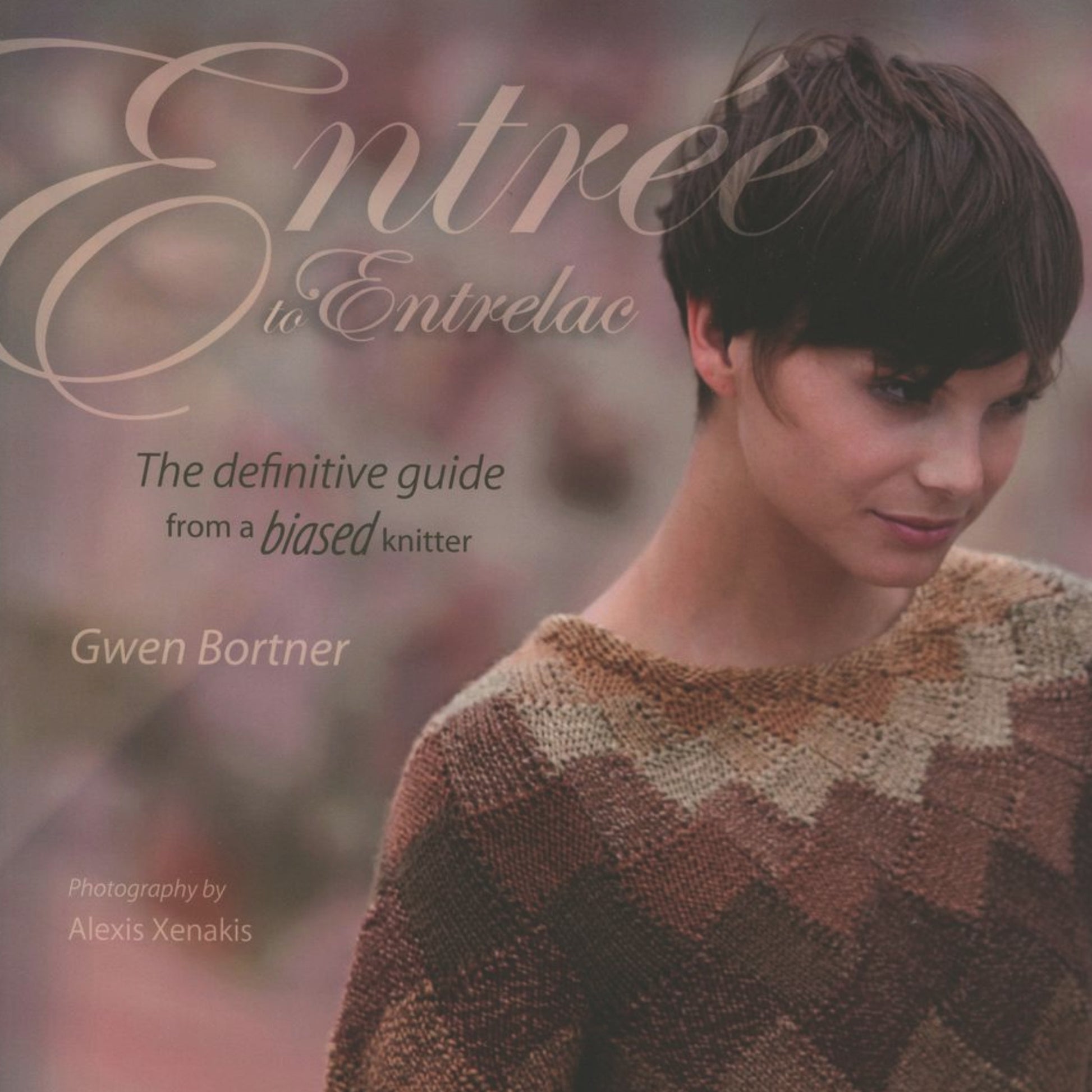 The cover of "Entree to Entrelac" by Gwen Bortner, published by Ingram Content, depicts a woman wearing an intricately knitted sweater in shades of brown, beige, and black. A soft, rosy gradient blurs the background. The text on the cover reads "The definitive guide from a biased knitter.