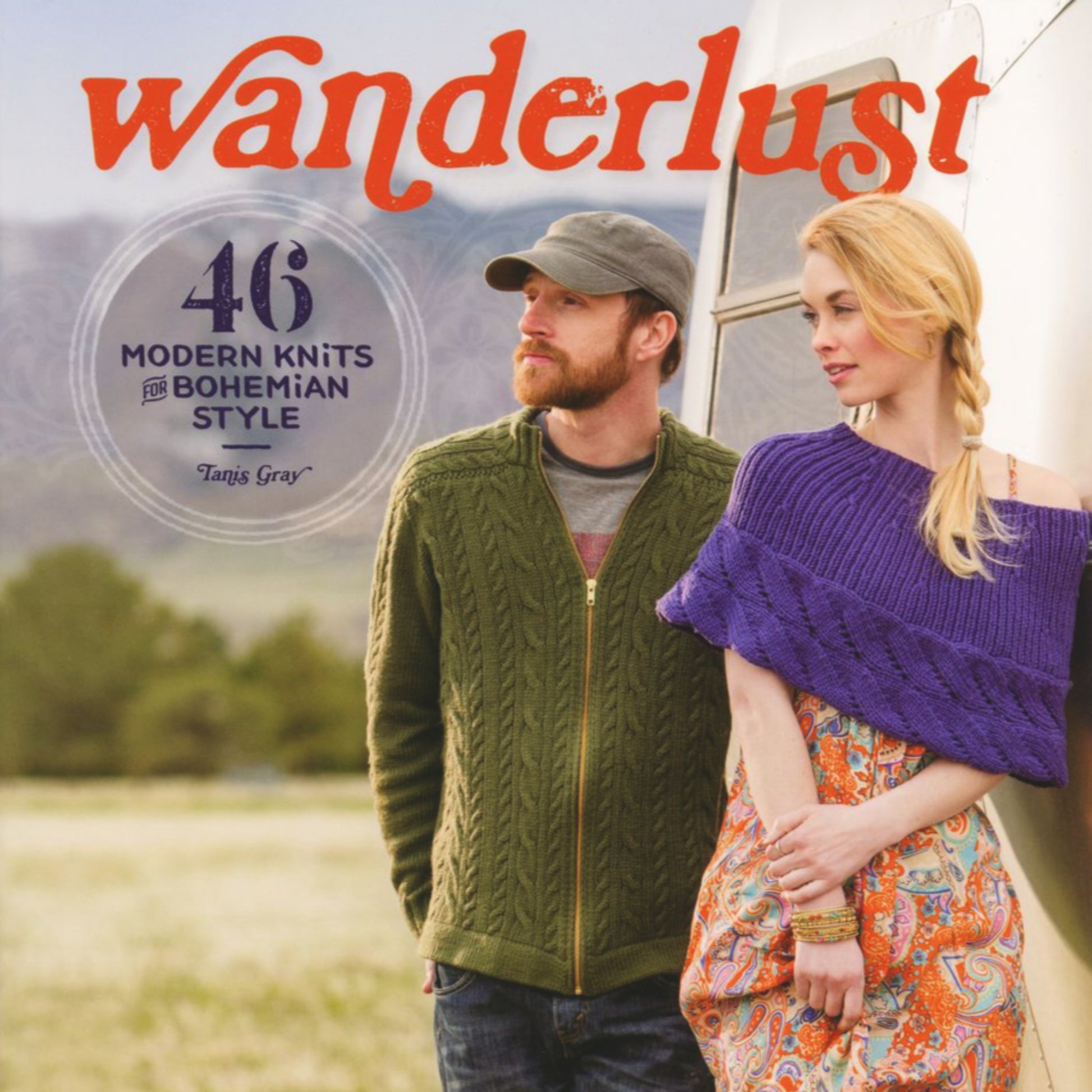 Cover of the book "Wanderlust - 46 Modern Knits for Bohemian Style" by Tanis Gray, published by Ingram Content. A man and a woman stand against a scenic outdoor backdrop. The man wears an extrafine merino wool sweater and a cap, while the woman wears a purple knit top over a patterned dress, showcasing their knitting projects.