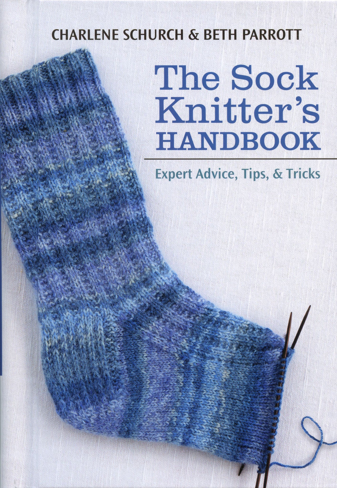 The "Sock Knitter's Handbook" by Charlene Schurch & Beth Parrott, published by Martingale & Co., features a book cover showcasing a partially knitted blue sock on needles. This guide includes essential cast-on techniques and offers a comprehensive stitch dictionary for knitting socks.