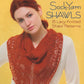 Cover of the book "Sock-Yarn Shawls" published by Martingale & Co. It features a woman with red hair wearing a white top and a red lacy knitted shawl. She is posing against a yellow background while looking towards the camera. Perfect for enthusiasts of knit shawls using beautiful sock yarns, the book offers 15 lacy knitted shawl patterns to explore.