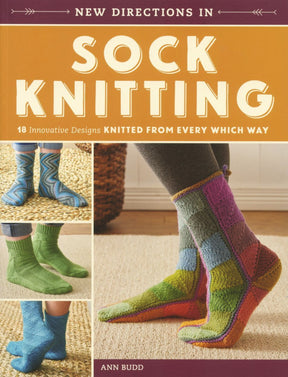 Cover of "New Directions in Sock Knitting: 18 Innovative Designs Knitted from Every Which Way" by Ann Budd, published by Ingram Content. Features images of colorful, intricately patterned socks in various designs, showcasing innovative constructions and step-by-step instructions for sock knitting enthusiasts.