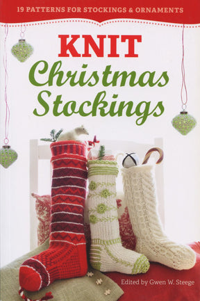 Cover of the book "Knit Christmas Stockings, 2nd Edition" by Workman Publishing - Storey. The cover features three knitted Christmas stockings in red, green, and white hanging on a white chair, accompanied by decorative ornaments and text at the top reading "19 Christmas Stocking Patterns & Ornaments.