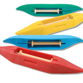 Image of four colorful Leclerc Budget Shuttles arranged diagonally. The shuttles are in green, yellow, blue, and red from top to bottom. Made by Leclerc Looms from high-density plastic, each shuttle has a beige spool-like object in the middle and features a sleek, pointed design—perfect for beginner weavers seeking cost-effective options.