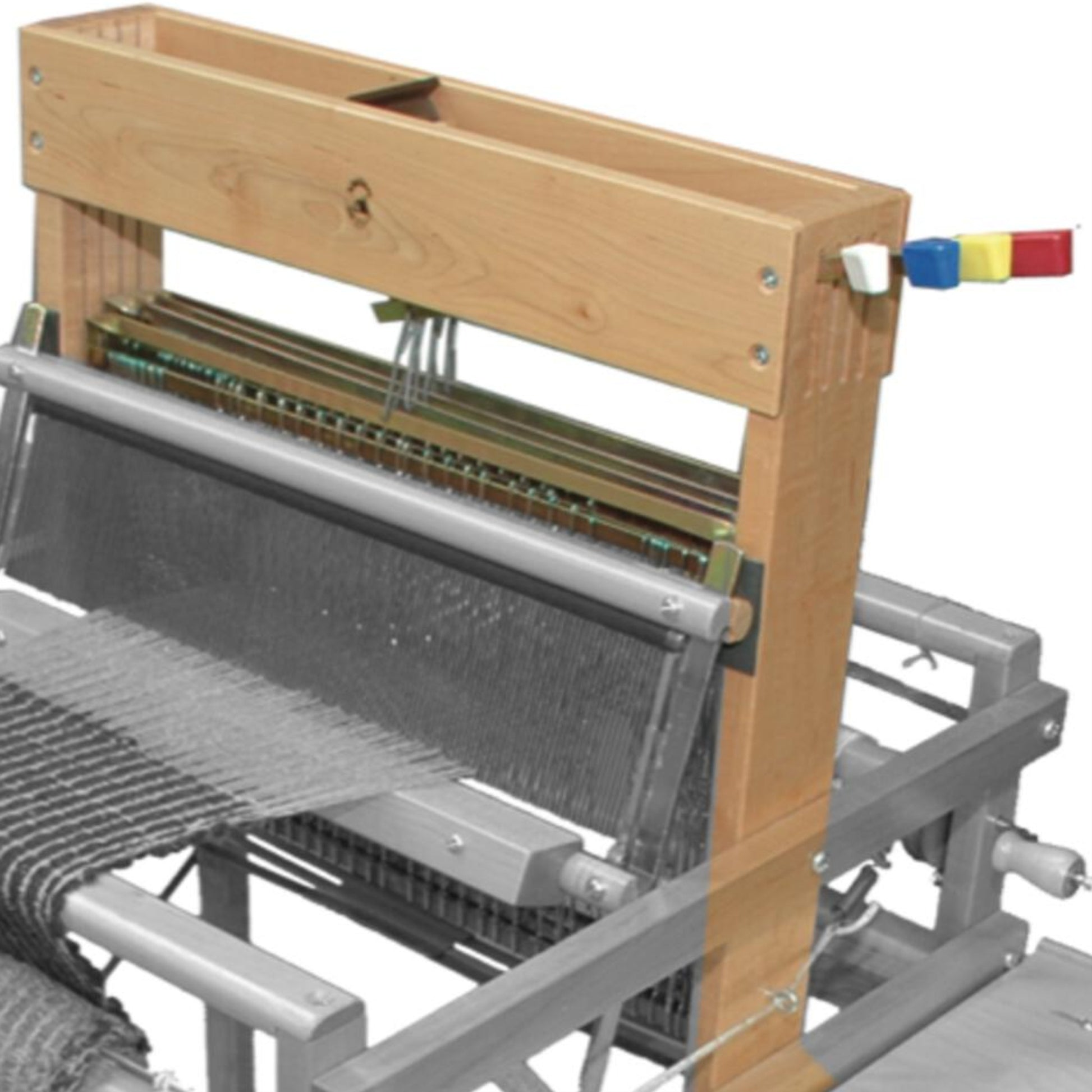 A Leclerc Dorothy 4-shaft section loom by Leclerc Looms features a wooden and metal structure with colored levers on the right side. Threads are partially woven into fabric, demonstrating the weaving process. The loom's shaft section and side crossmembers are prominently visible, showcasing its intricate components.