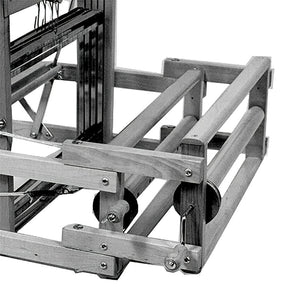 A close-up black and white image of the Leclerc Double Warp Beam Dorothy & Voyageur by Leclerc Looms. The loom features multiple rectangular wooden frames, rods, and metal components. The mechanical parts are visible, showcasing the intricate details and structure of this advanced weaving equipment.