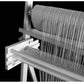 A close-up of the Leclerc Penelope II 22.5" Rigid Heddle Tapestry Loom from Leclerc Looms in black and white. Threads are meticulously arranged and stretched across this premium tapestry loom, showcasing the detailed craftsmanship involved in the weaving process. The loom, equipped with two rigid heddles, is positioned against a dark background.