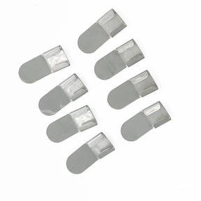 Eight Leclerc Sectional Warp Beam Guides from Leclerc Looms, metallic silver in color and arranged in two rows on a white background. These rectangular-shaped guides have one rounded end and a small lip, perfect for attaching to a surface or securing an item in place.