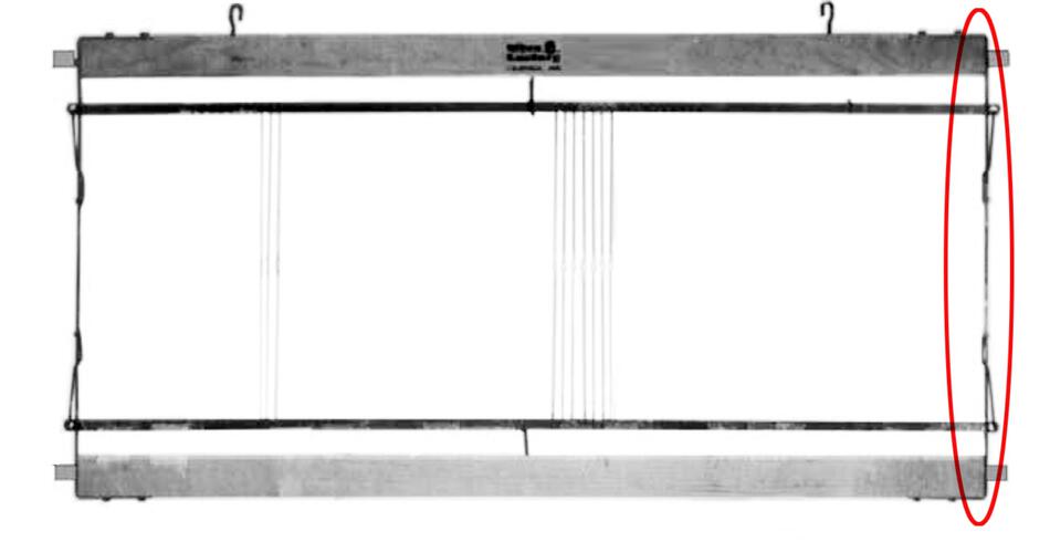 A Leclerc Harness/Shaft frame end piece with heddle bar support spring hangs horizontally with two hooks on the top side and a red oval encircling an area on the right side. The frame, typical of a Leclerc Loom, has five evenly spaced vertical lines extending across its width in the middle.