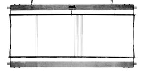 The Leclerc Complete Shaft/Harness Frame for Looms, by Leclerc Looms, is a large, rectangular metal frame featuring thin vertical threads stretched towards the center to form a sparse pattern. The top of the frame includes two hooks for hanging, giving the overall structure a minimal and industrial appearance.