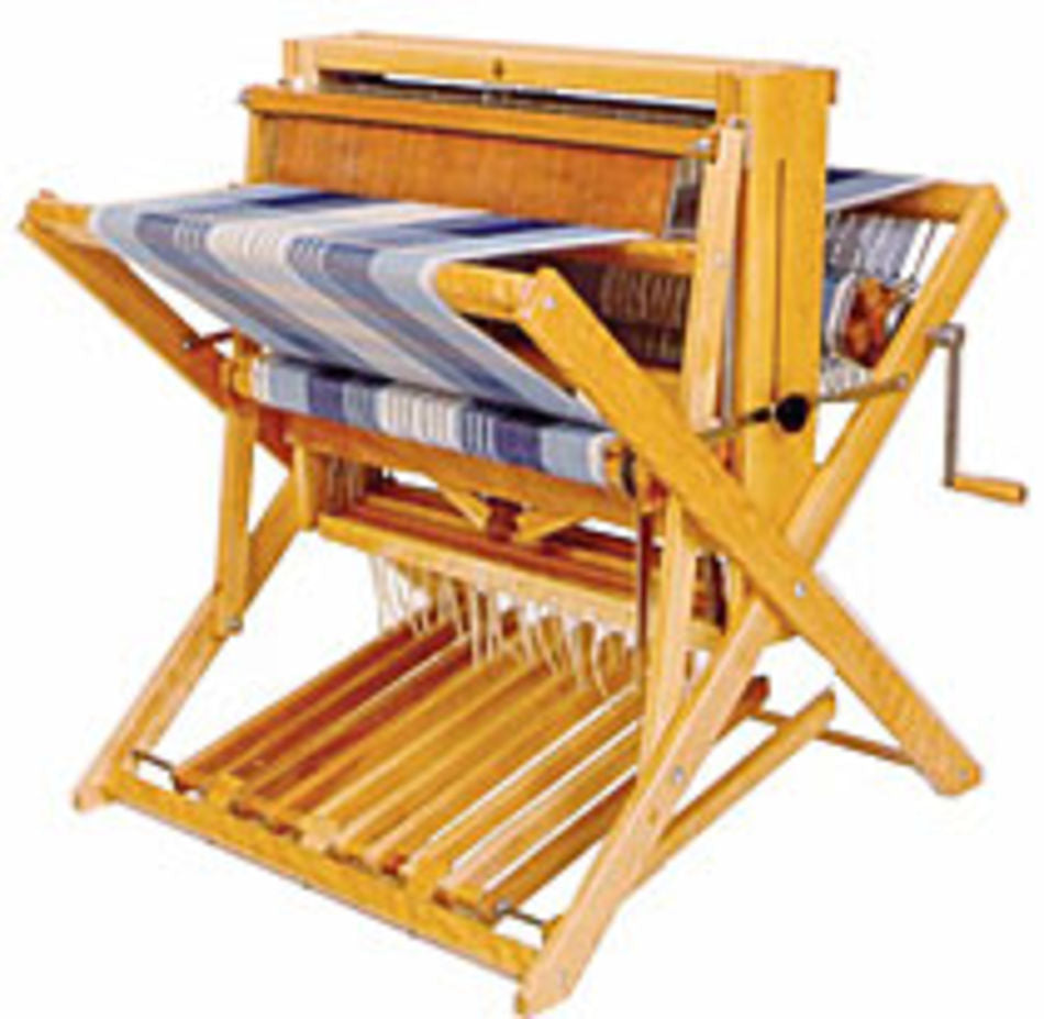 The Leclerc Compact 24" Floor Loom by Leclerc Looms features a partially completed blue and white striped fabric. The loom includes a foot pedal at the bottom, a hand crank on the side, and various levers and mechanisms for controlling the weaving process.