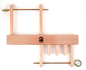 Introducing the Leclerc Threading Helper by Leclerc Looms: a light-colored wooden burr puzzle featuring interlocking rectangular and cylindrical pieces, complemented by metal rods. This ingenious puzzle lies flat on a plain white background and assembles cleverly like lease sticks in weaving.