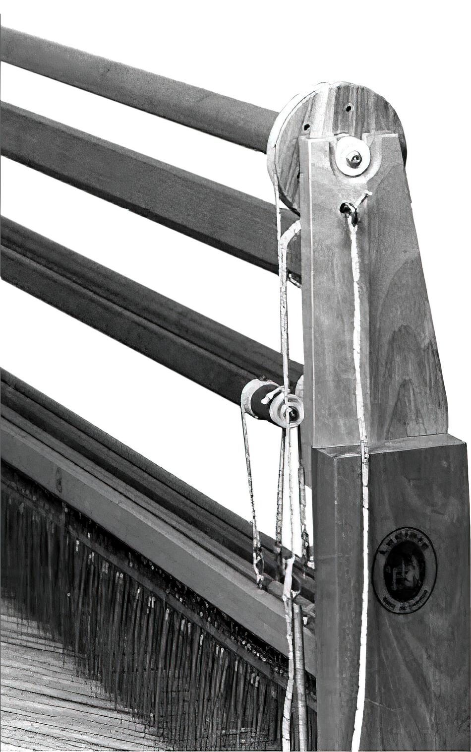 Black and white image of the Leclerc Shed Regulator by Leclerc Looms, showing the wooden frame, rollers, and heddles in detail. The loom is designed for weaving fabric and displays a seal with an emblem on the side. The intricate detail of the weaving mechanism is clearly visible.