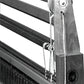 Black and white image of a Leclerc Shed Regulator's side section, showcasing visible wooden support beams, threads, and tightly aligned needles. A distinct Leclerc Looms logo is present on the bottom right of the loom's vertical support.