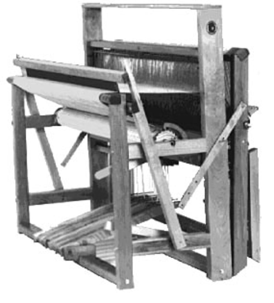 A black and white image of the Leclerc Nilus II 4-Shaft Floor Loom from Leclerc Looms. The loom exhibits a complex structure with multiple beams, levers, and pedals, designed for the craft of weaving fabric. The threads are draped and ready to be woven.