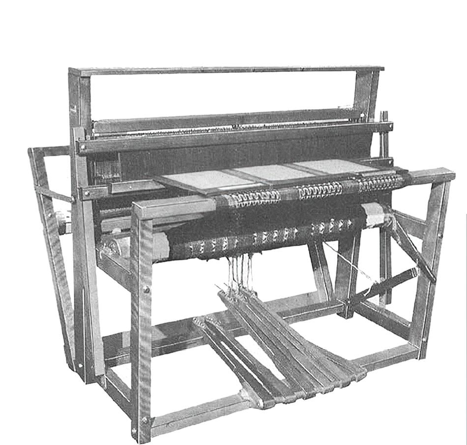 A monochrome image showing a Leclerc Nilus 4-Shaft 6-Treadle Jack Floor Loom by Leclerc Looms. The wooden structure's detailed mechanics include heddles, treadles, and a series of warp threads. The loom appears functional, emphasizing the detailed craftsmanship and intricate design typical of old weaving machinery.