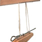 A Leclerc Treadle Hook from Leclerc Looms is shown in the image. The hook features two strings attached to it, which are secured onto a rod, suspended from a horizontal wooden beam, forming a simple hanging mechanism.