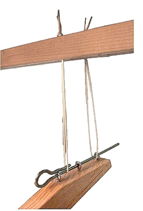 A wooden beam suspended with white strings is supported by a green metal rod looped through Leclerc Treadle Hooks from Leclerc Looms, and twine is used to connect the contraption to the supporting structure above.